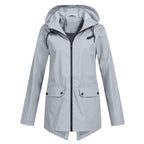 Women's longline hooded raincoat with zip front and flap pockets