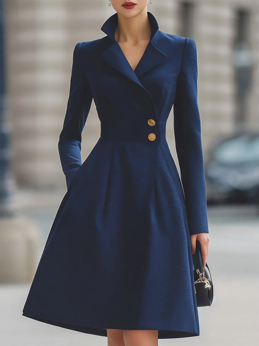Women's navy tailored coat dress with peak lapels and gold-tone buttons