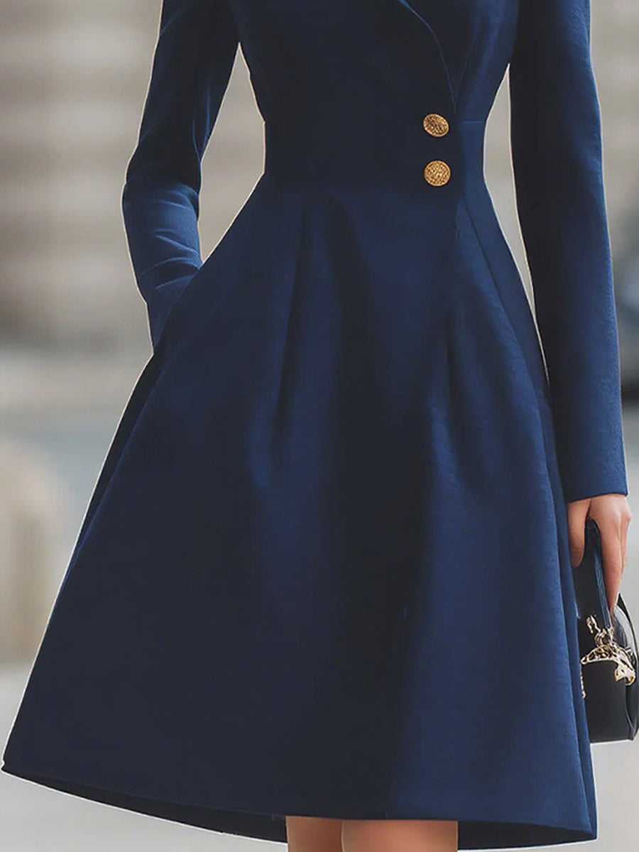 Women's navy tailored coat dress with peak lapels and gold-tone buttons