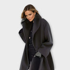 Women's open front jacket with wide lapels and long sleeves