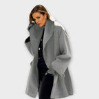 Women's open front jacket with wide lapels and long sleeves