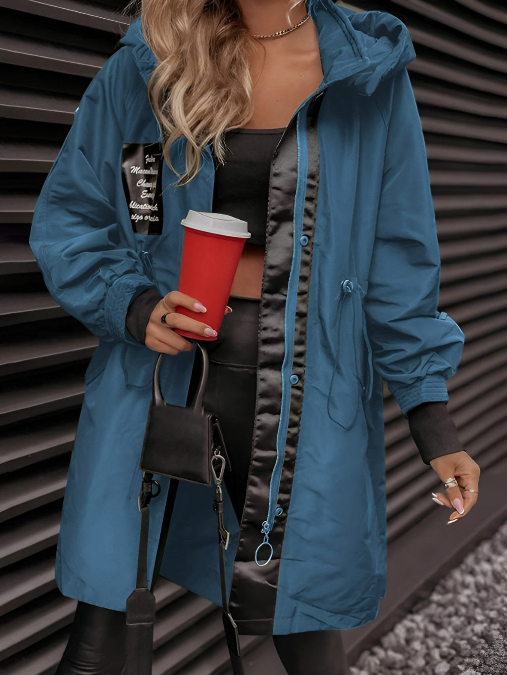 Women's oversized hooded windbreaker jacket with front pockets