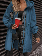Women's oversized hooded windbreaker jacket with front pockets