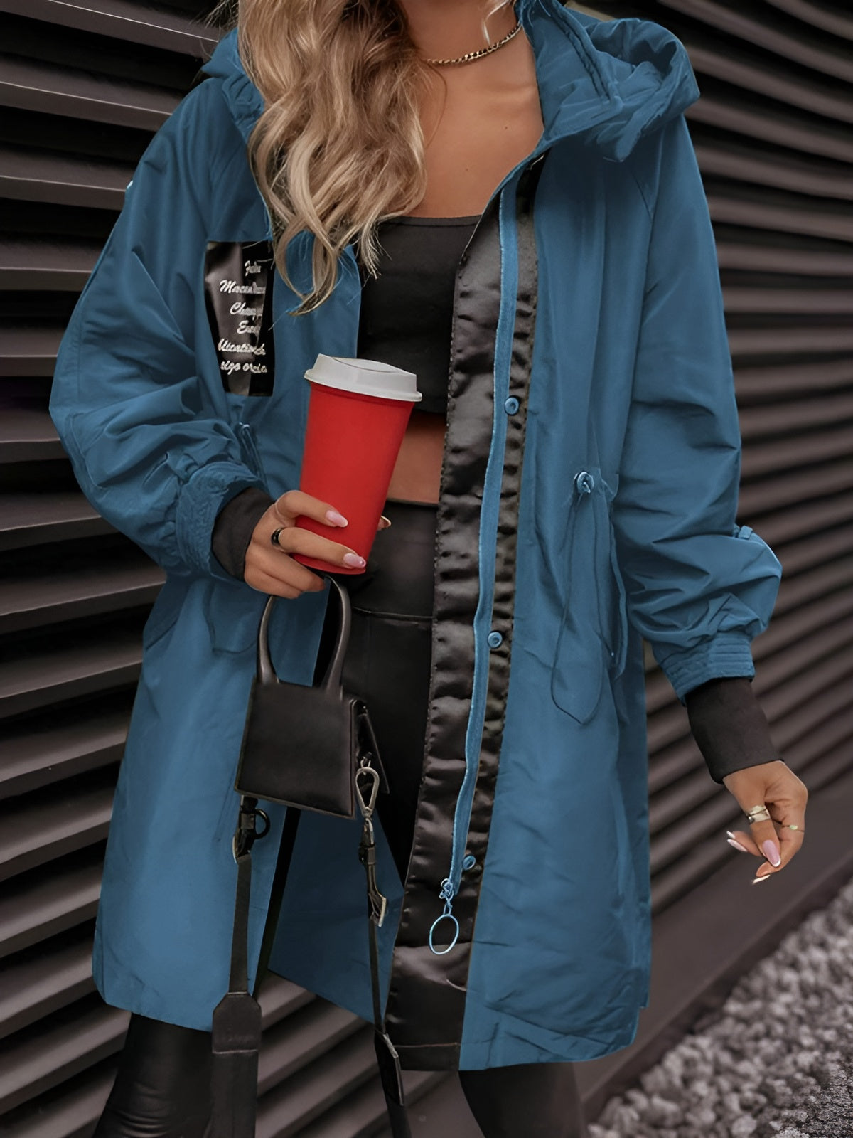 Women's oversized hooded windbreaker jacket with front pockets