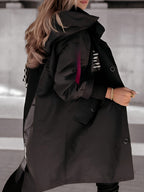 Women's oversized hooded windbreaker jacket with front pockets