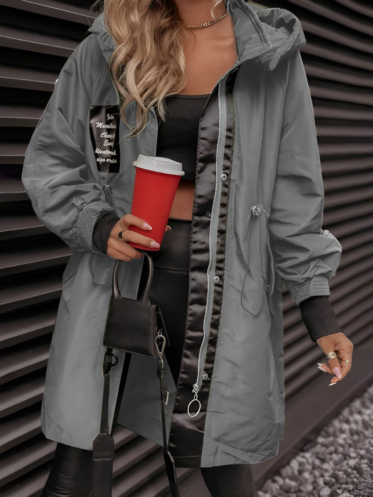 Women's oversized hooded windbreaker jacket with front pockets