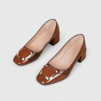 Women's textured pointed-toe loafers with mid block heels and metallic back details