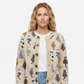 Women's beige cardigan with repeated cat pattern, crew neck and button front