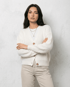 Women's white V-neck knit cardigan with button front