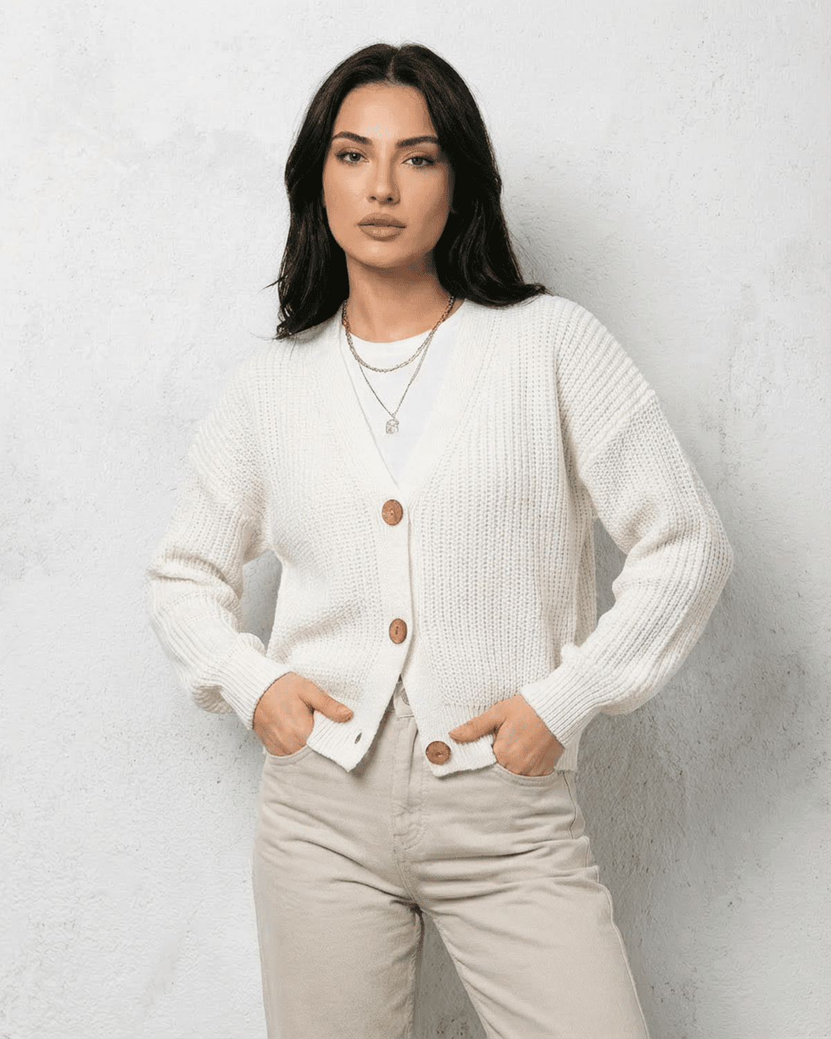 Women's white V-neck knit cardigan with button front