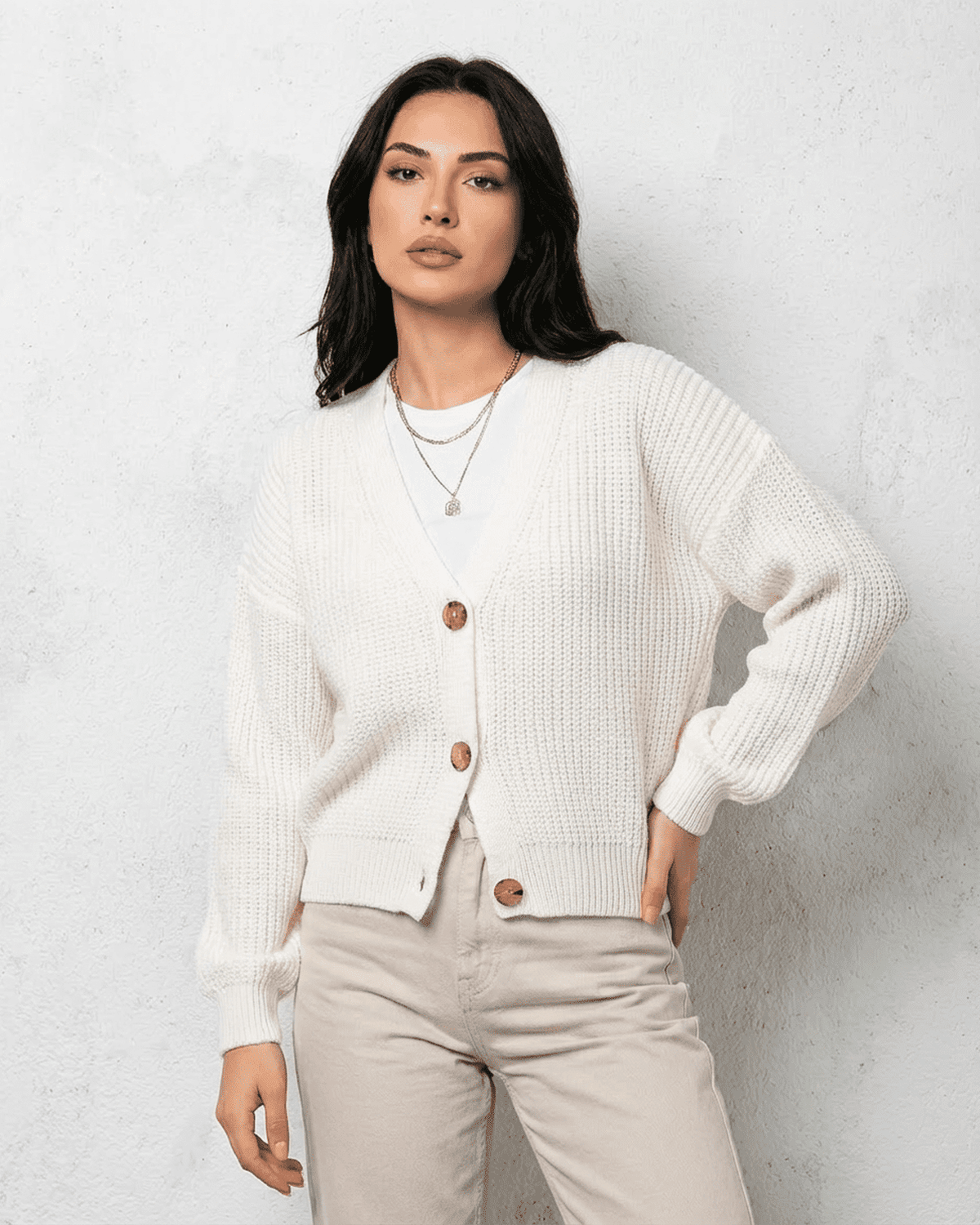 Women's white V-neck knit cardigan with button front