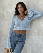Women's pale blue cropped openwork cardigan with V-neck, buttons and flared cuffs