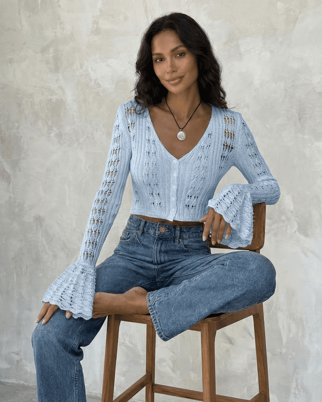 Women's pale blue cropped openwork cardigan with V-neck, buttons and flared cuffs