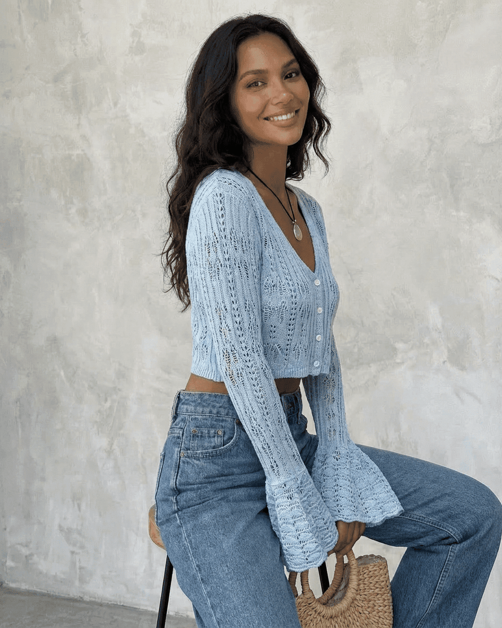 Women's pale blue cropped openwork cardigan with V-neck, buttons and flared cuffs
