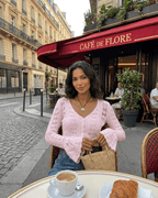 Women's pink cropped openwork cardigan with V-neckline and flared cuffs