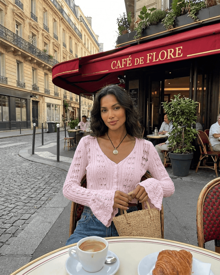 Women's pink cropped openwork cardigan with V-neckline and flared cuffs