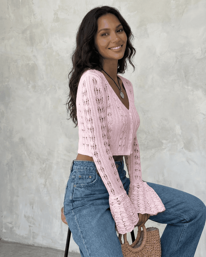 Women's pink cropped openwork cardigan with V-neckline and flared cuffs