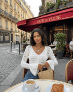 Women's white openwork cropped cardigan with V-neck and flared sleeves