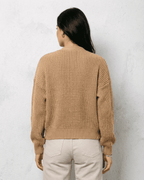 Women's textured V-neck cardigan with pearl-style trim and buttons