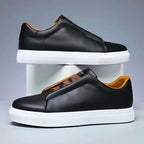 Unisex low-top panelled sneakers with lace-up front and flat sole