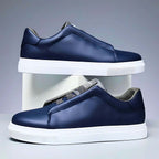 Unisex low-top panelled sneakers with lace-up front and flat sole