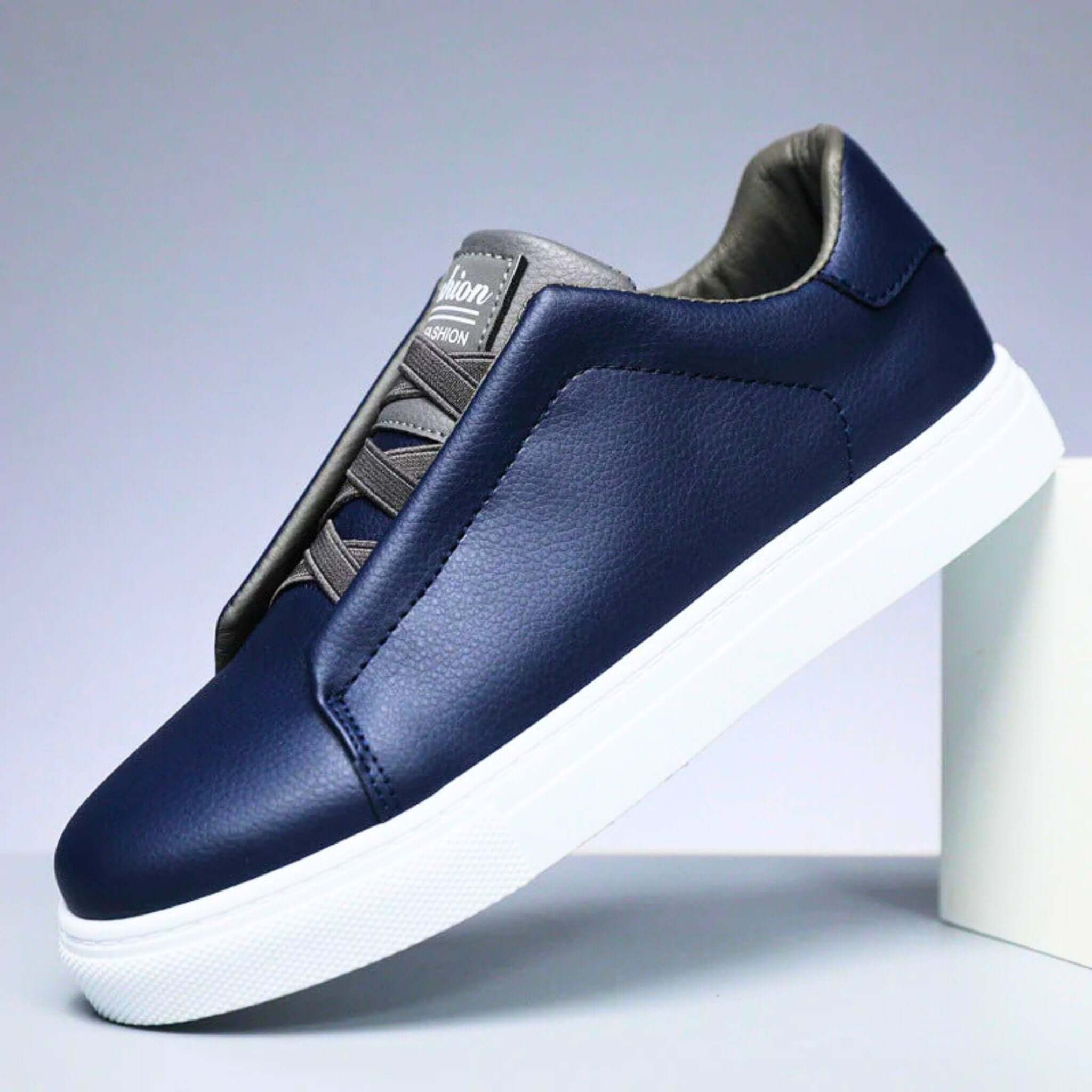 Unisex low-top panelled sneakers with lace-up front and flat sole