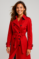 Women's long belted double-breasted trench coat with notched lapels and buckle cuffs