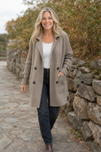 Women's longline double-breasted coat with knitted sleeves and buckle cuffs