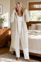Women's longline hooded cable knit cardigan with long sleeves and front pockets