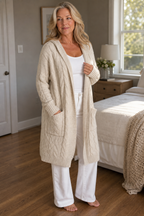 Women's longline hooded cable knit cardigan with long sleeves and front pockets