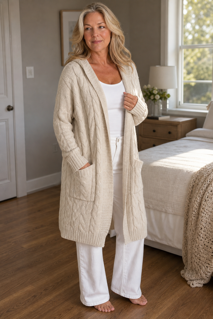 Women's longline hooded cable knit cardigan with long sleeves and front pockets