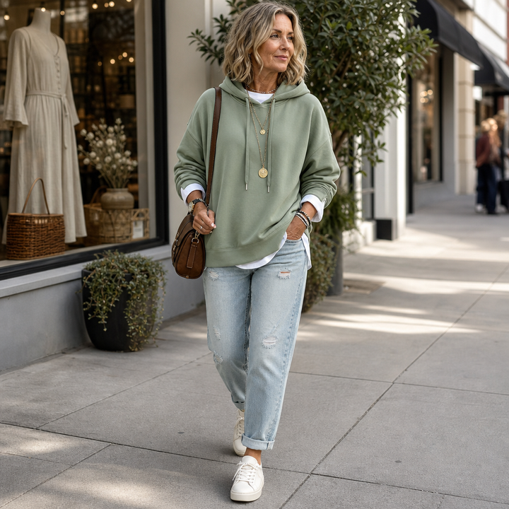 Women's layered two-tone hem hoodie with drawstring hood and long sleeves