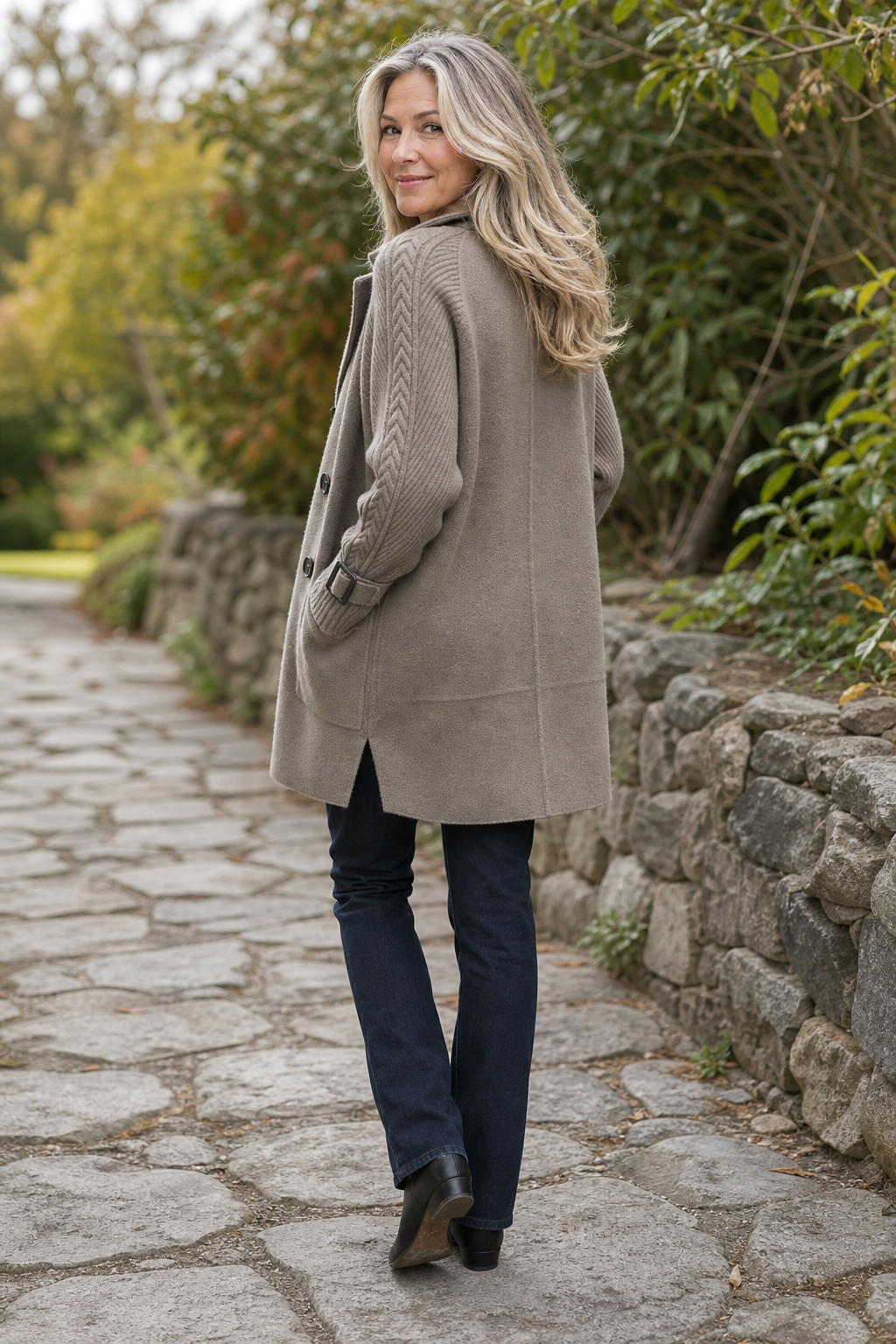 Women's longline double-breasted coat with knitted sleeves and buckle cuffs