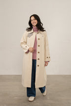 Women's longline waterproof trench coat with button front and checked collar trim