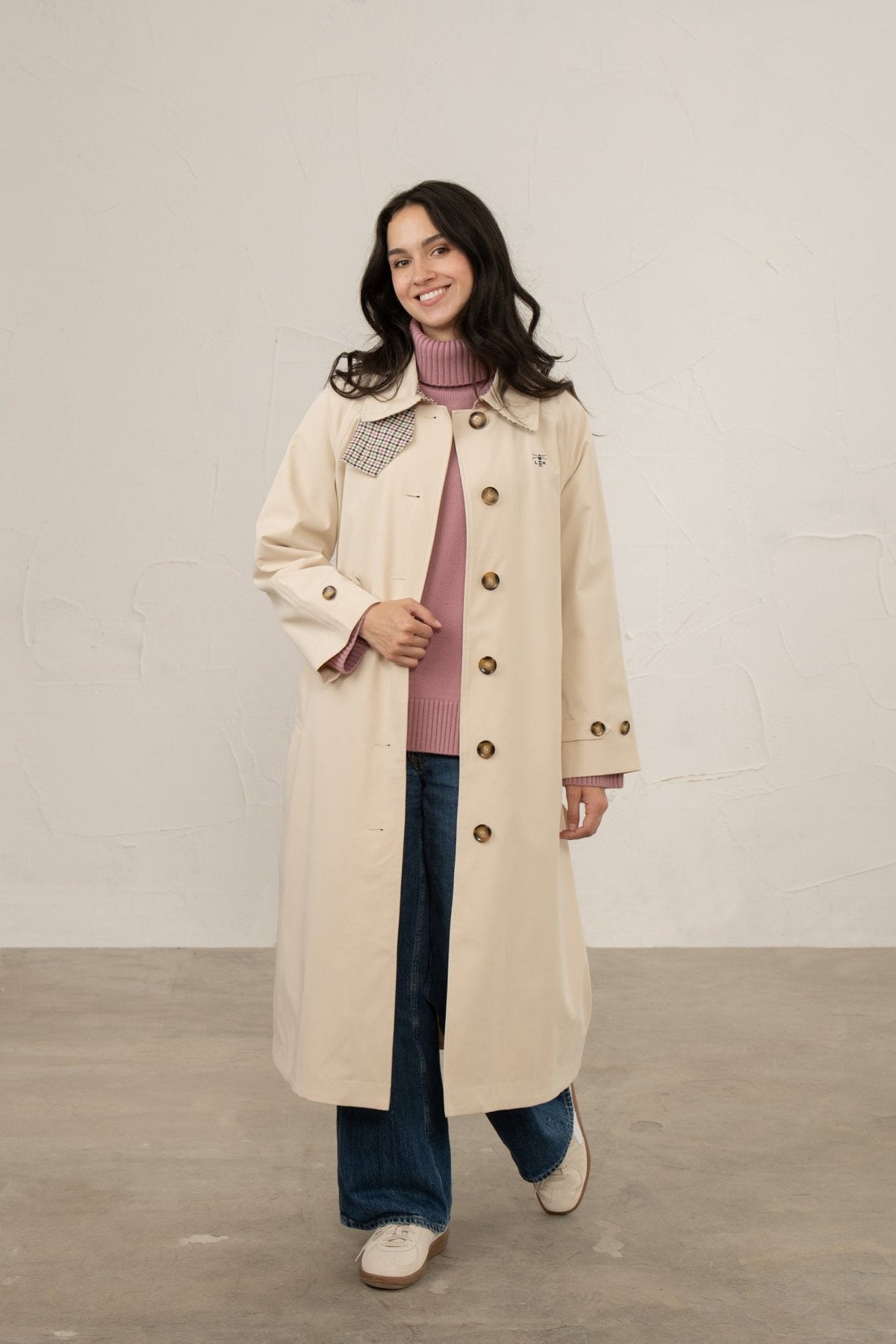 Women's longline waterproof trench coat with button front and checked collar trim