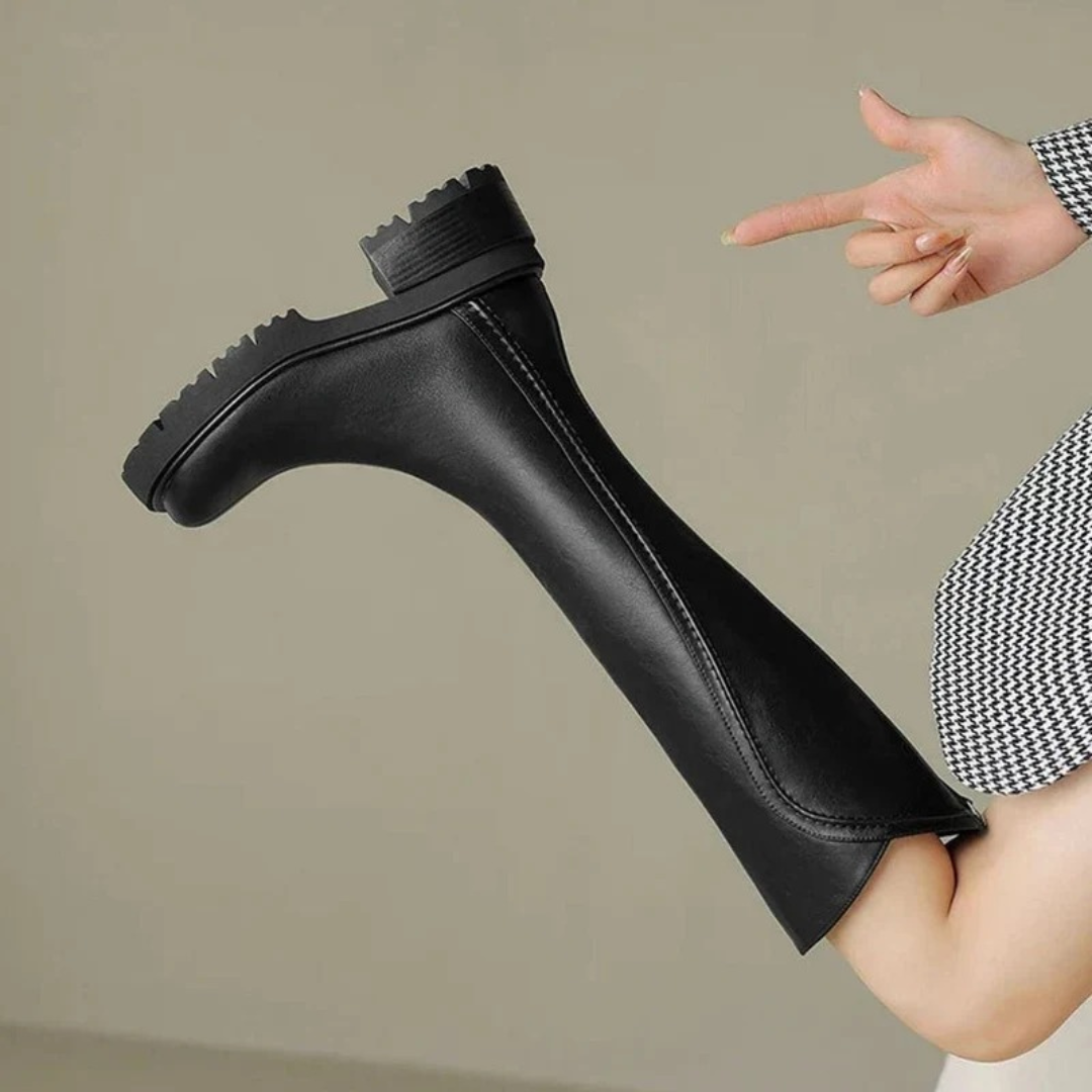 Women's tall boots with round toes, side zips and chunky lug soles