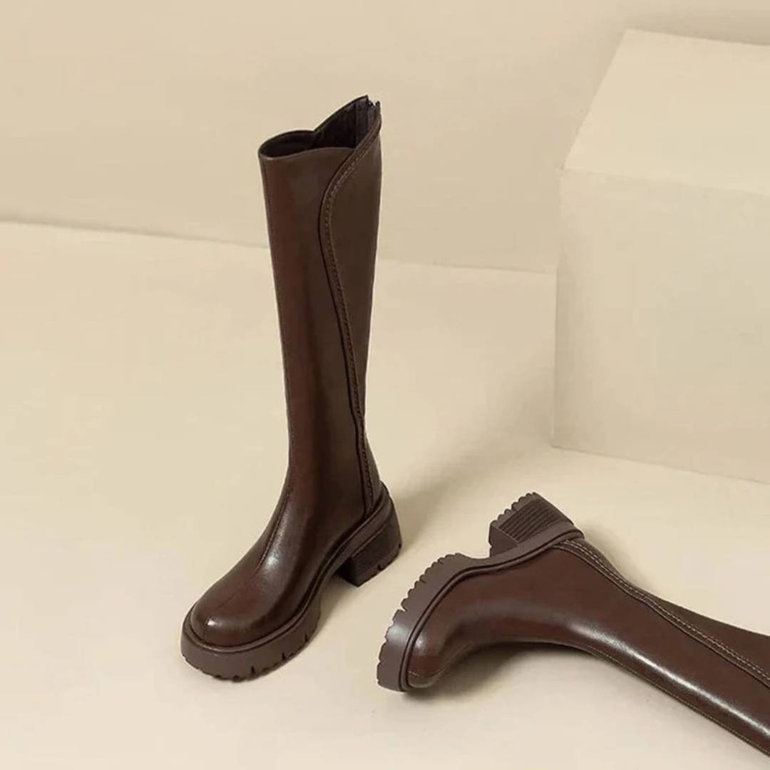 Women's tall boots with round toes, side zips and chunky lug soles