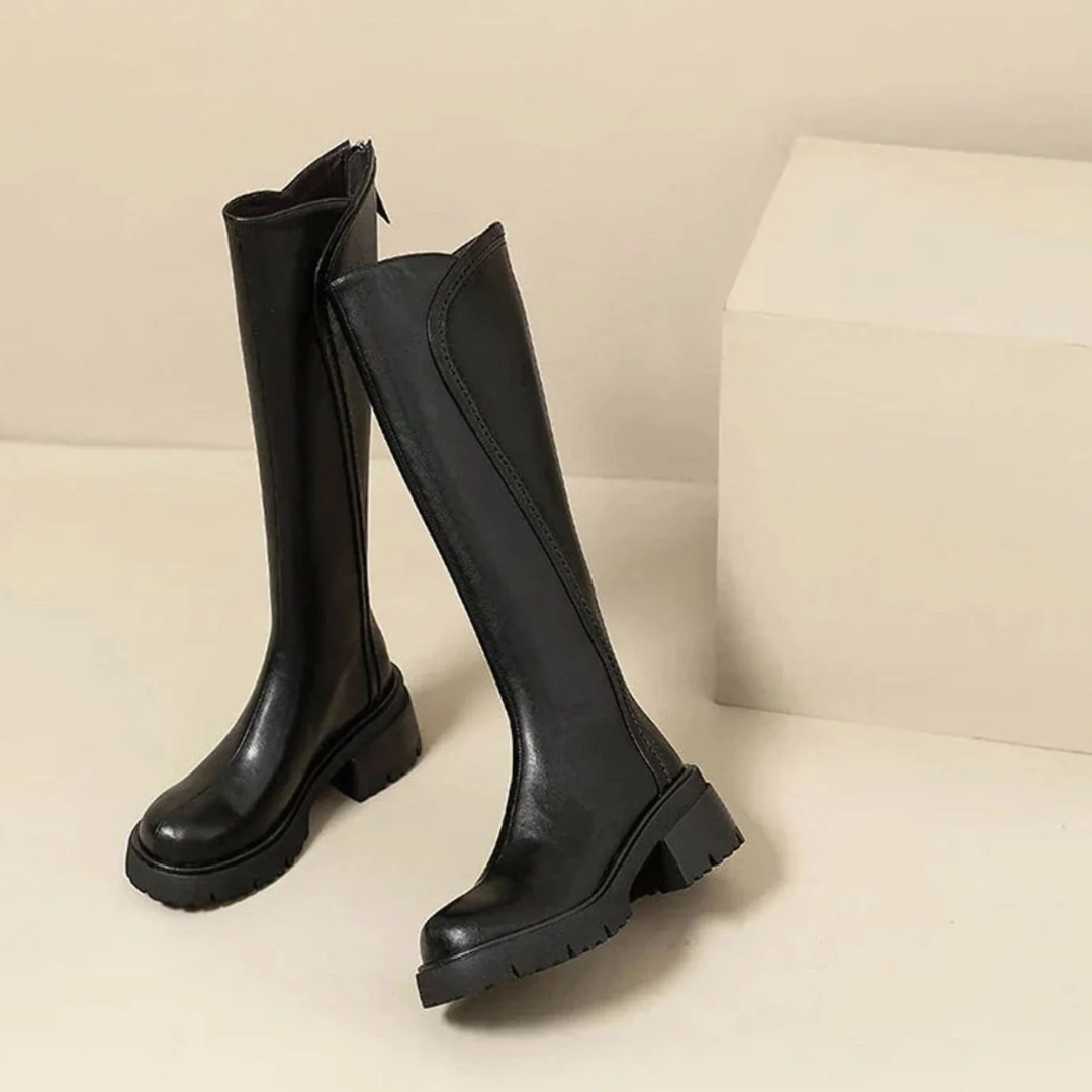 Women's tall boots with round toes, side zips and chunky lug soles