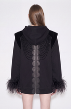 Women's black zip hoodie with embellished front and feather-trimmed cuffs