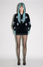 Black velvet hoodie with blue star appliqués and turquoise hood fringe