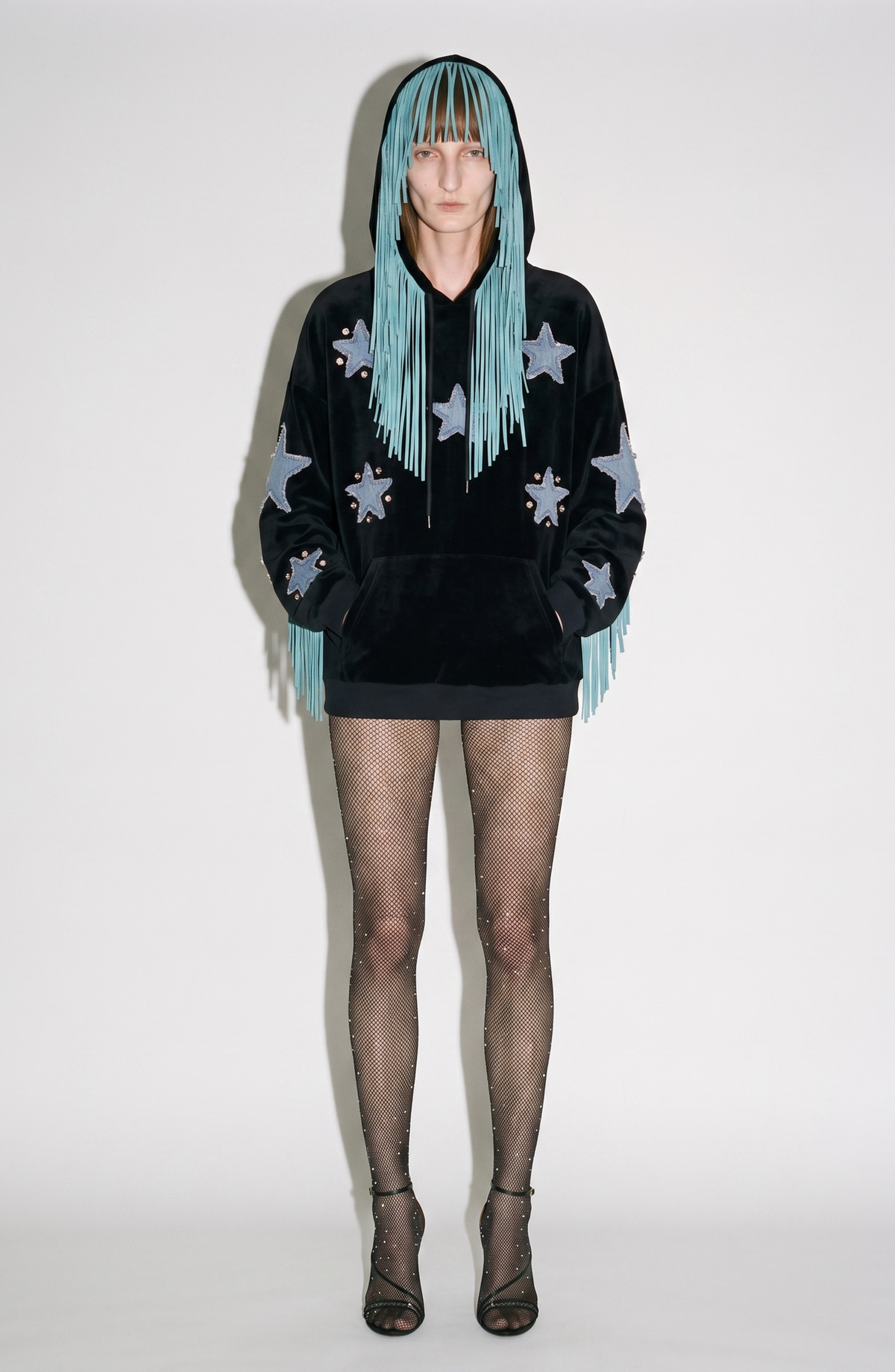 Black velvet hoodie with blue star appliqués and turquoise hood fringe