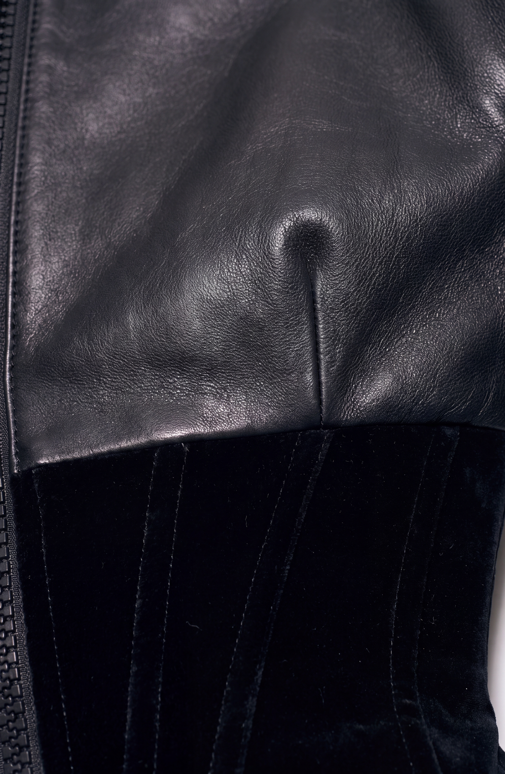 Women's black cropped corset jacket with long sleeves and front zip