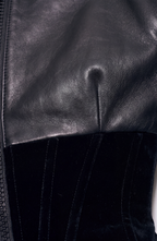 Women's black cropped corset jacket with long sleeves and front zip