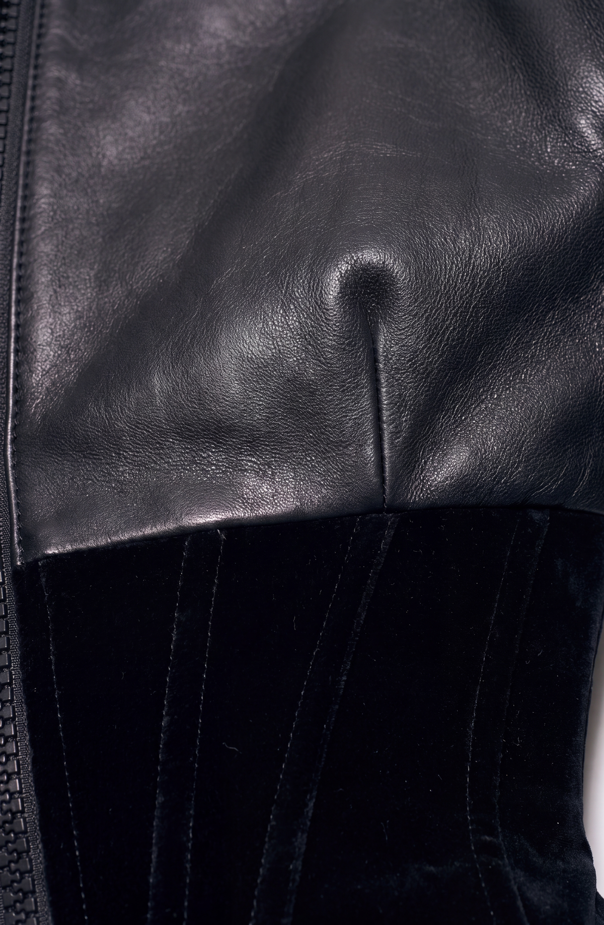 Women's black cropped corset jacket with long sleeves and front zip
