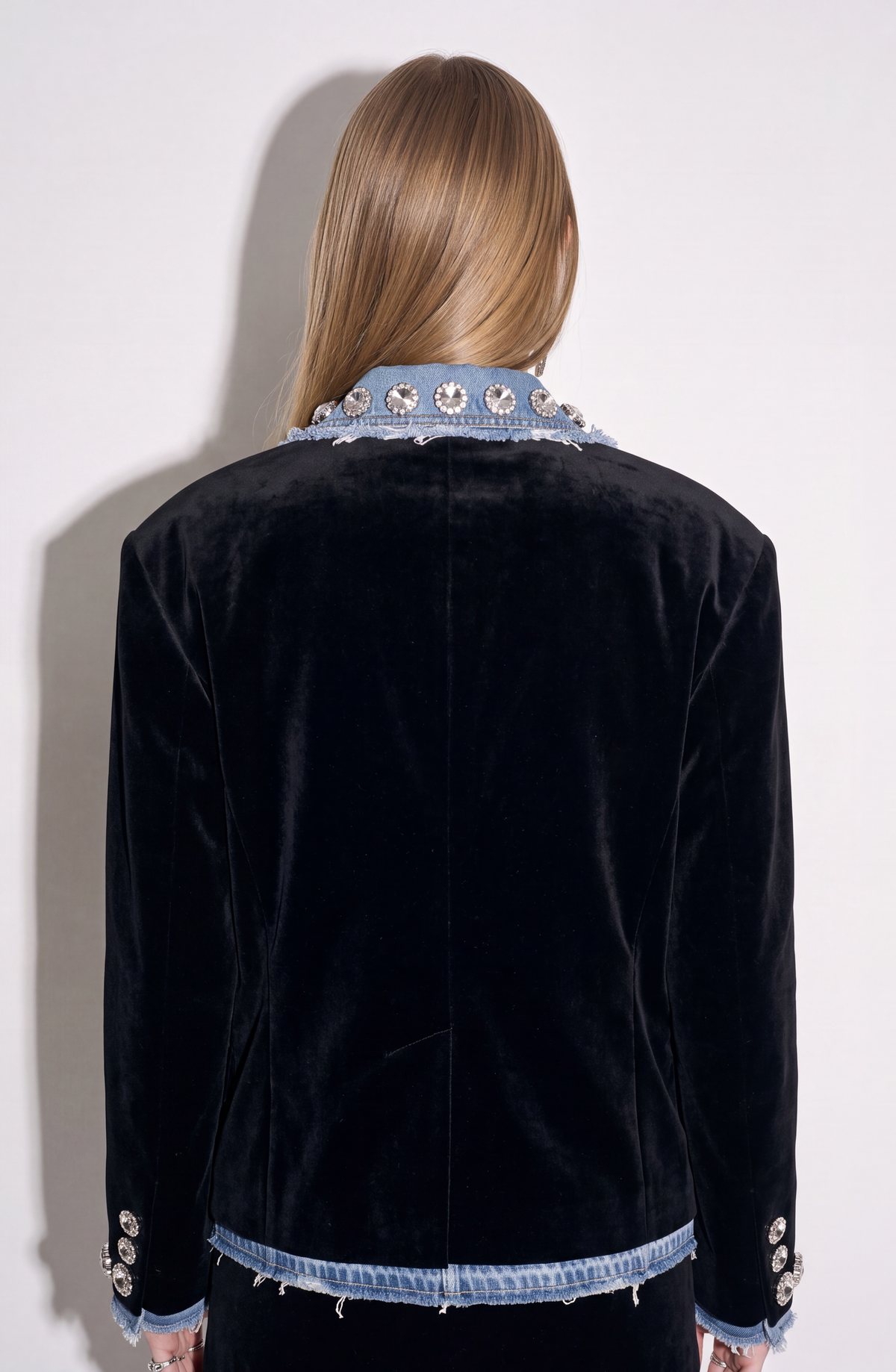 Women's black blazer with blue denim lapels, silver embellishments and long sleeves