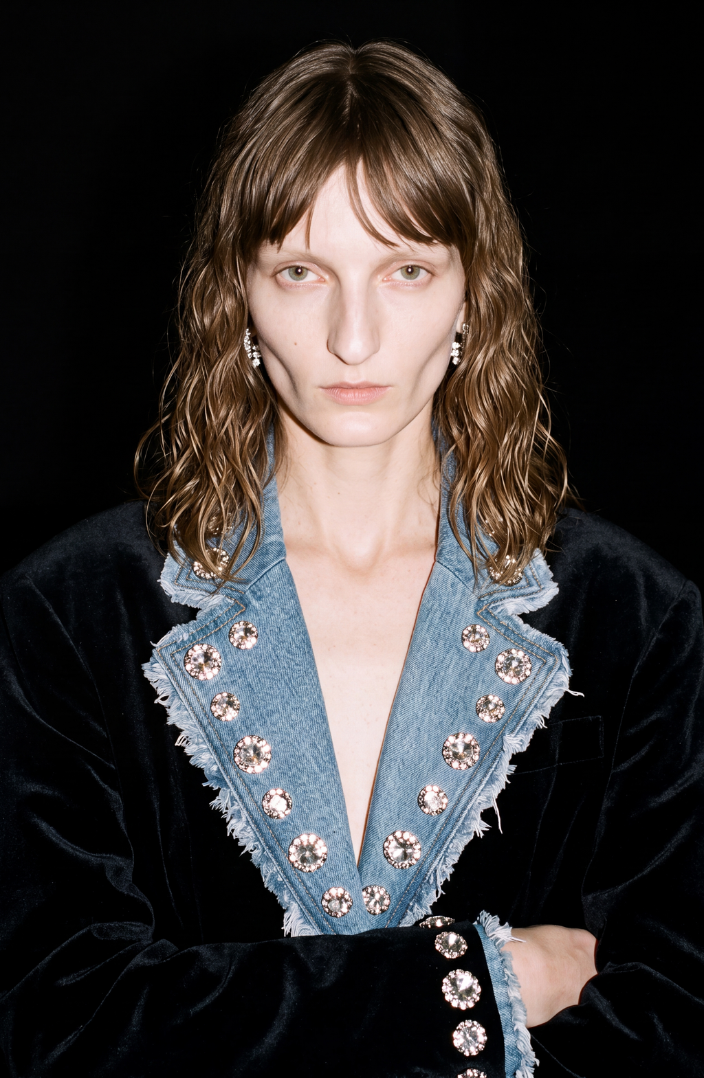 Women's black blazer with blue denim lapels, silver embellishments and long sleeves