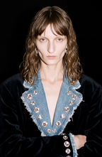 Women's black blazer with blue denim lapels, silver embellishments and long sleeves
