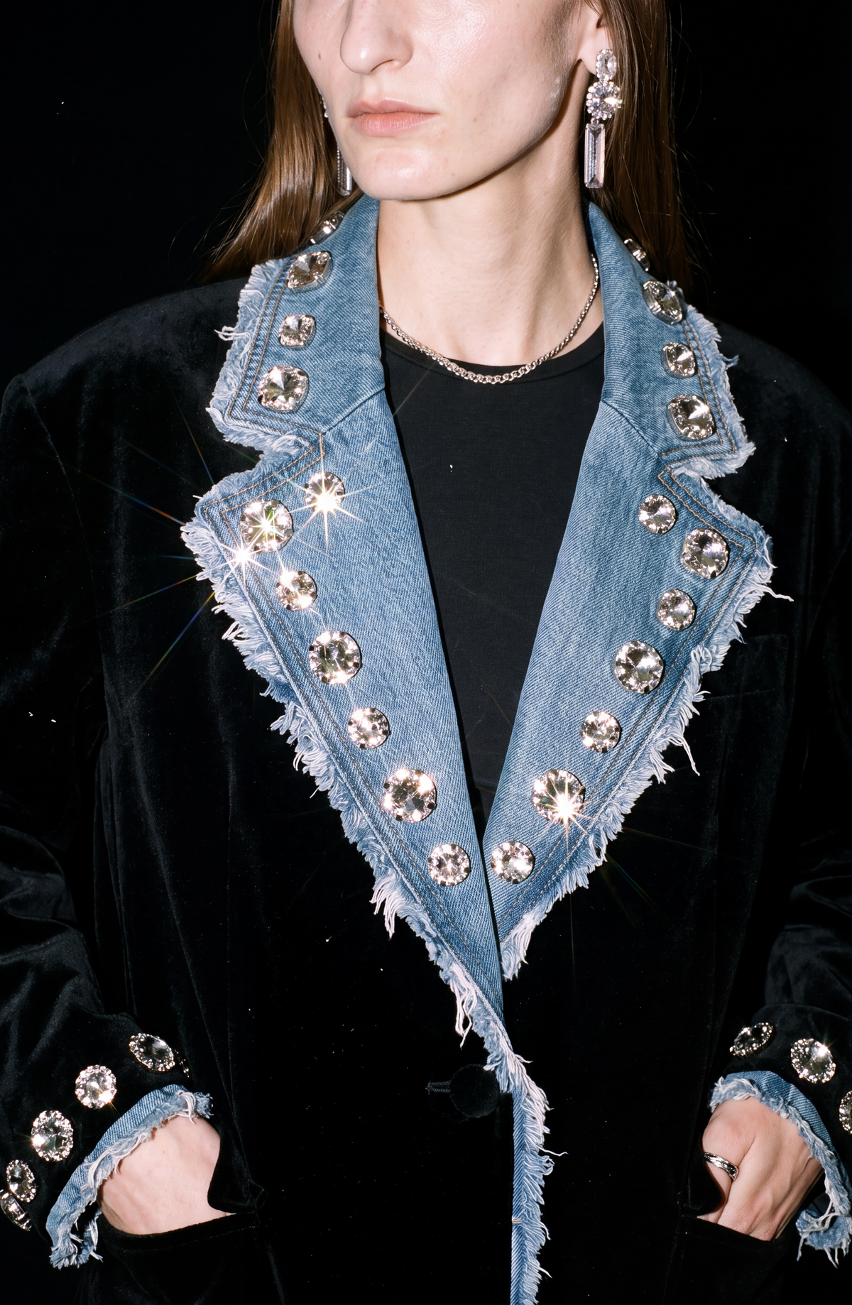 Women's black blazer with blue denim lapels, silver embellishments and long sleeves