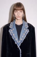 Women's black blazer with blue denim lapels, silver embellishments and long sleeves