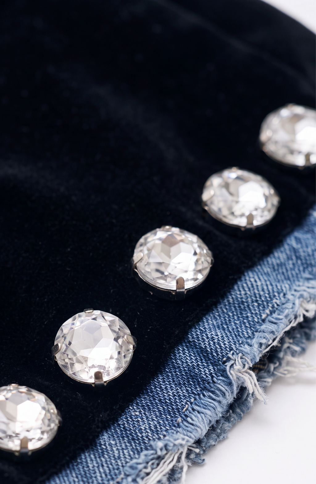 Women's black blazer with blue denim lapels, silver embellishments and long sleeves
